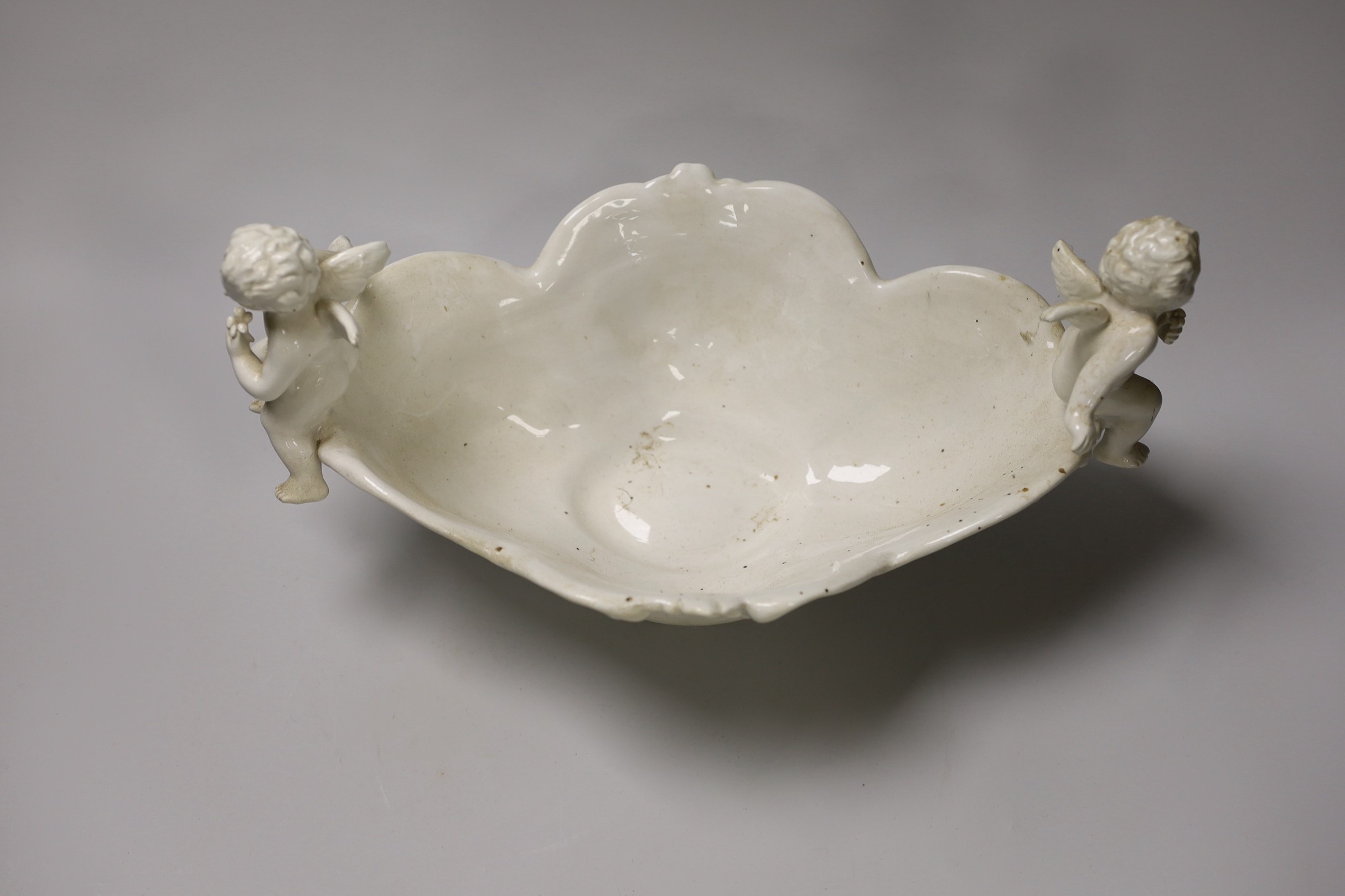 An Italian pottery 'cherub' dish and a Copeland pottery bowl